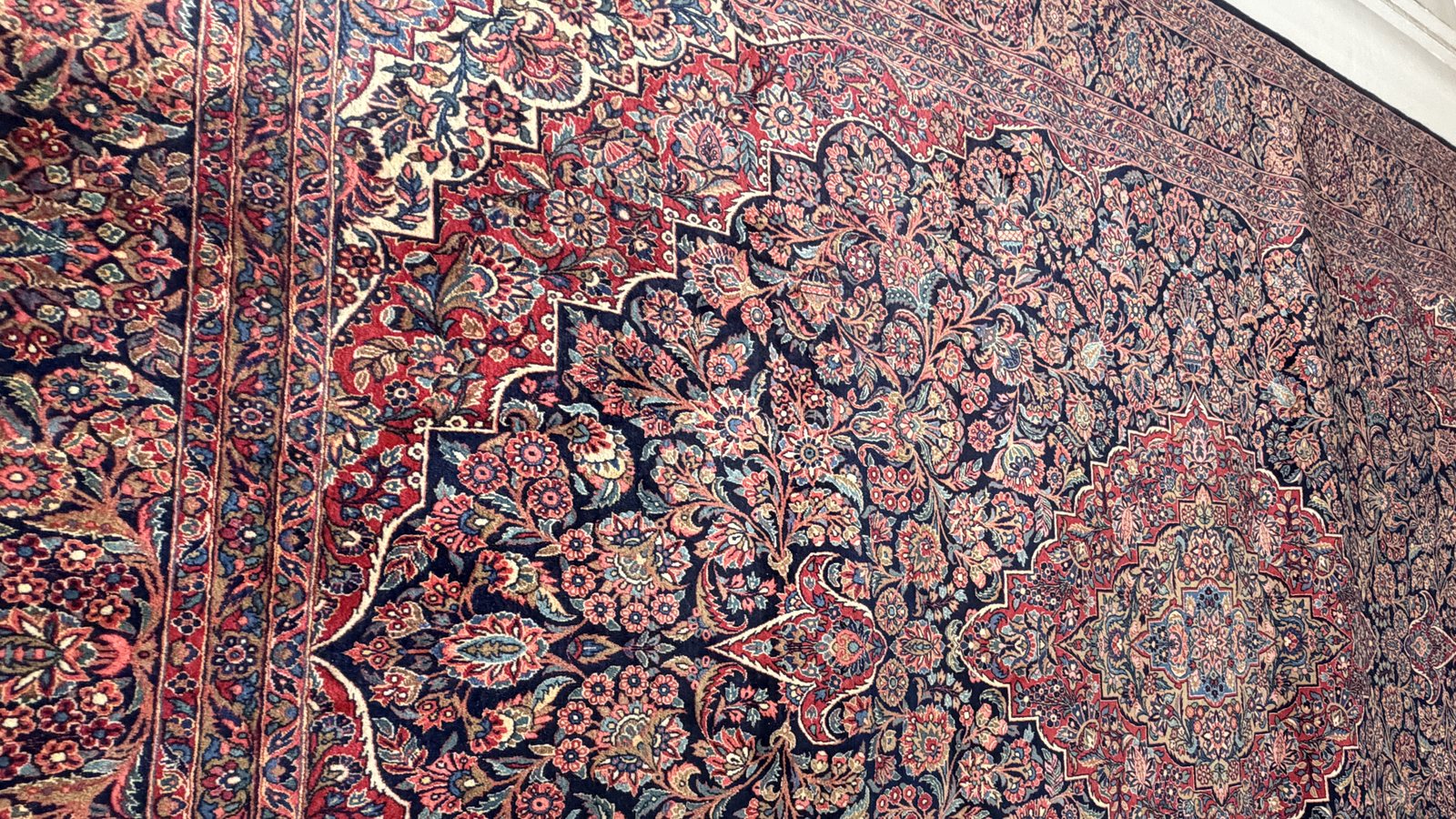 A rolled rug ready for collection at the workshop